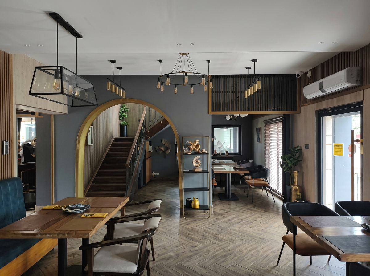 Inside The Zero — main dining room with feature staircase